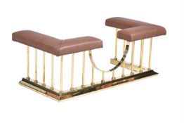 A BRASS AND LEATHER UPHOLSTERED CLUB FENDER, OF RECENT MANUFACTURE