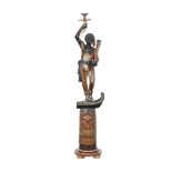 A VENETIAN EBONISED AND POLYCHROME PAINTED BLACKAMOOR TORCHERE