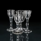 FOUR VARIOUS FACET-STEMMED WINE GLASSES