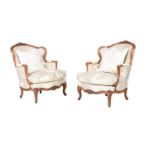 A PAIR OF WALNUT AND UPHOLSTERED ARMCHAIRS IN LOUIS XVI STYLE