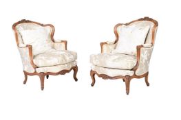 A PAIR OF WALNUT AND UPHOLSTERED ARMCHAIRS IN LOUIS XVI STYLE