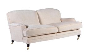 AN UPHOLSTERED TWO SEAT SOFA