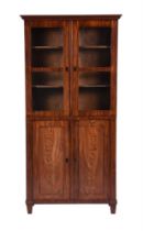 A CONTINENTAL MAHOGANY BOOKCASE CABINET