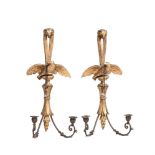 A PAIR OF CARVED GILTWOOD AND METAL MOUNTED TWIN BRANCH WALL LIGHTS IN GEORGE III STYLE