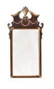 A MAHOGANY AND PARCEL GILT WALL MIRROR IN 18TH CENTURY STYLE