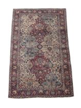 A PERSIAN RUG, PROBABLY A QUM OR TABRIZ