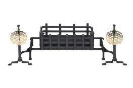 AN ARTS & CRAFTS BLACK PAINTED IRON AND BRASS FIRE GRATE