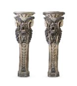 A PAIR OF ITALIAN POLYCHROME STUCCO PEDESTALS 17TH CENTURY With grotesque masks above guilloche ba