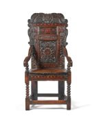A CHARLES II CARVED OAK AND INLAID PANEL BACK ARMCHAIR OF YORKSHIRE TYPE, CIRCA 1680