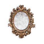 A SMALL ITALIAN CARVED GILTWOOD OVAL MIRROR, SECOND HALF 18TH CENTURY