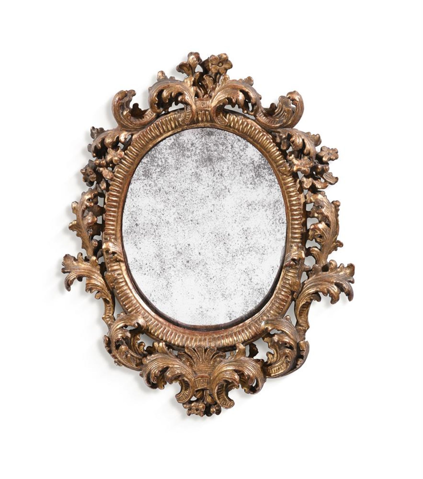 A SMALL ITALIAN CARVED GILTWOOD OVAL MIRROR, SECOND HALF 18TH CENTURY