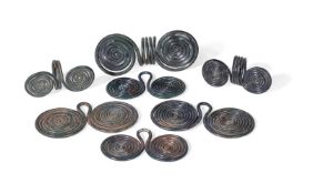A GROUP OF CENTRAL EUROPEAN BRONZE HAIR RINGS AND SPIRAL PENDANTS, LATE BRONZE AGE