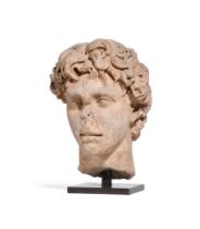 A ROMAN WHITE MARBLE PORTRAIT HEAD OF A YOUNG MAN, 2ND CENTURY A.D.