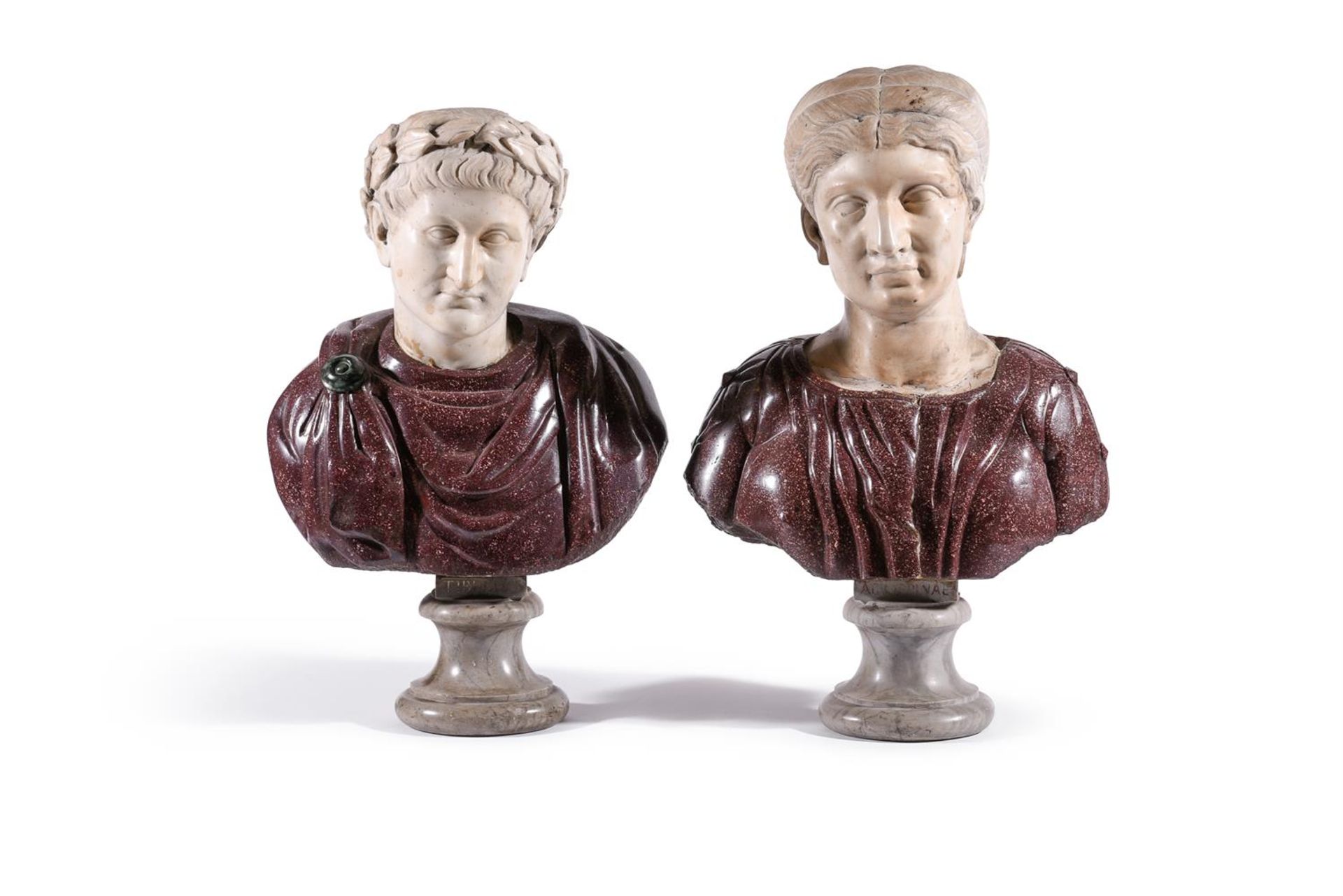A NEAR PAIR OF ITALIAN WHITE MARBLE AND PORPHYRY BUSTS OF ANCIENT ROMANS, 17TH CENTURY OR EARLIER
