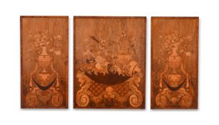 A SET OF THREE WALNUT AND MARQUETRY PANELSIN THE MANNER OF WRIGHT & MANSFIELD