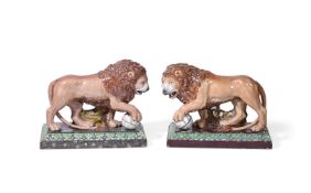 A CLOSELY MATCHED PAIR OF STAFFORDSHIRE PEARLWARE MEDICI LIONS, 19TH CENTURY