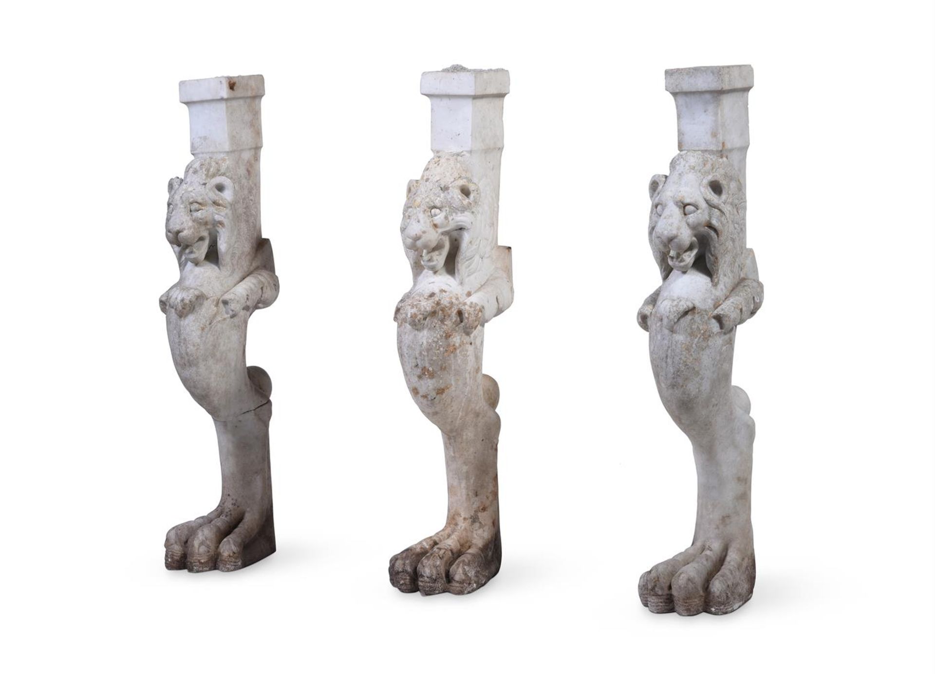 A SET OF THREE ITALIAN WHITE MARBLE LION MONOPODIA, EARLY 19TH CENTURY