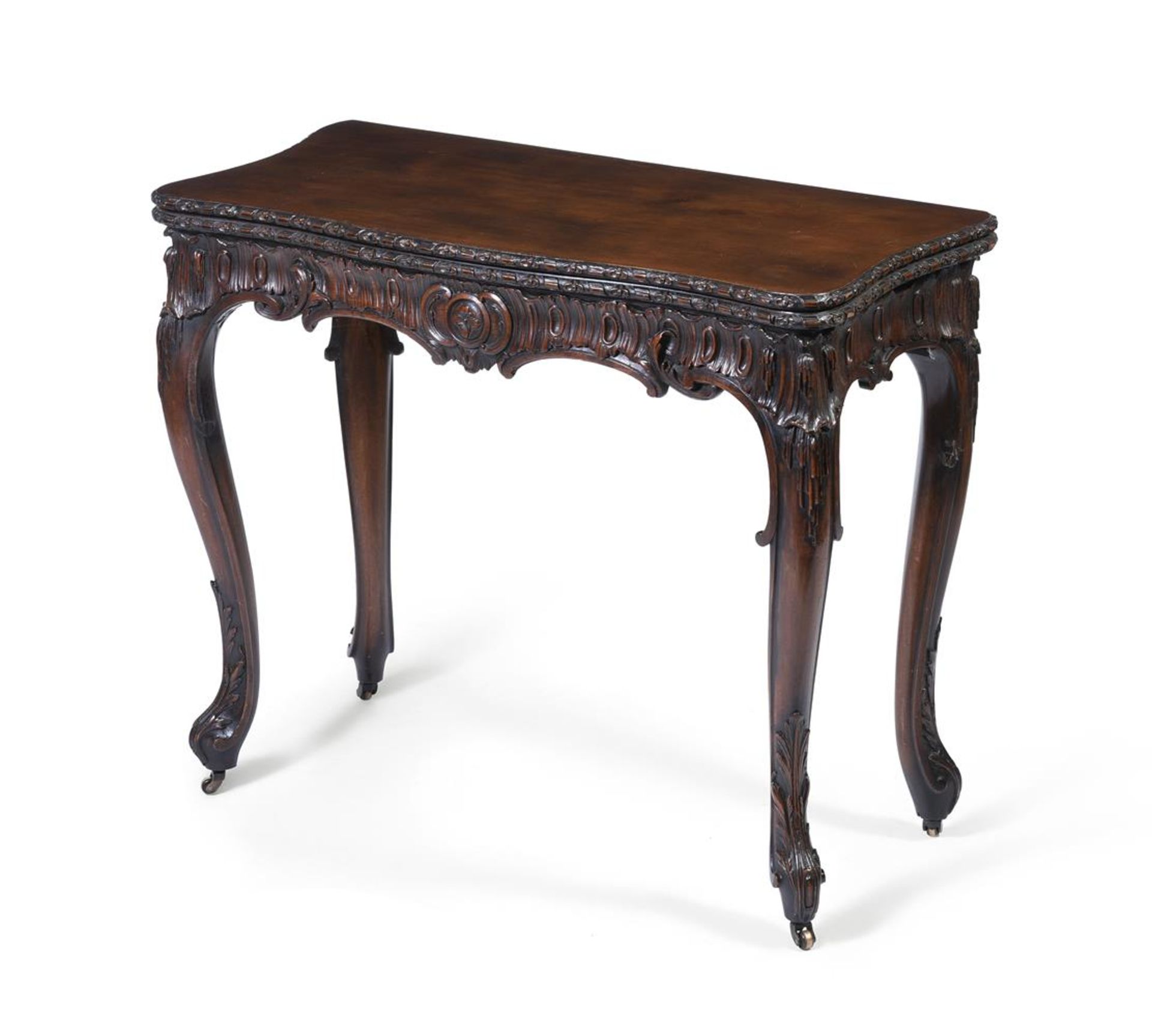 A CARVED MAHOGANY FOLDING CARD TABLEIN GEORGE III STYLE