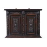 A FRENCH CARVED WALNUT CABINET, 16TH OR 17TH CENTURY