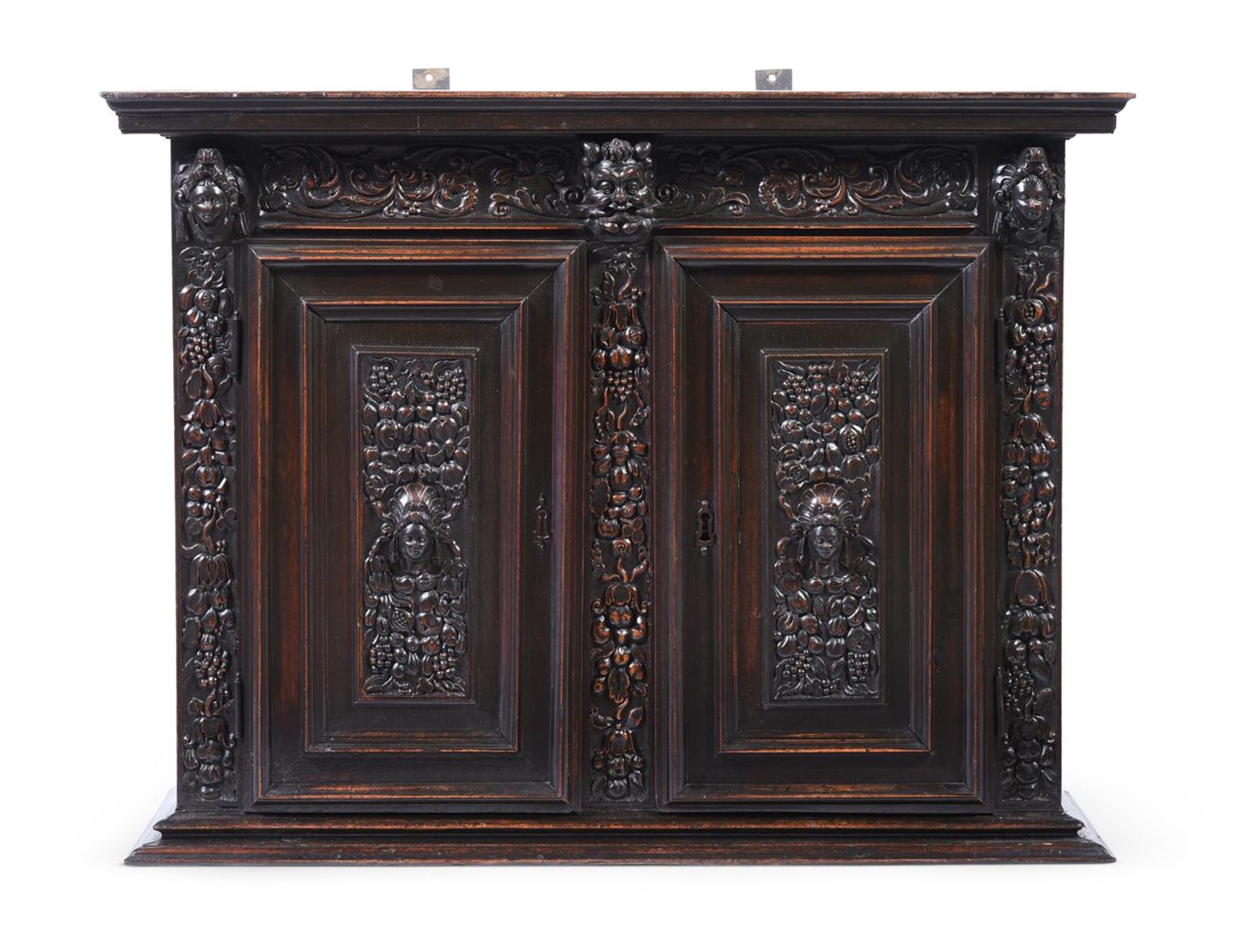 A FRENCH CARVED WALNUT CABINET, 16TH OR 17TH CENTURY