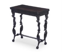 Y AN ANGLO-INDIAN CARVED MACASSAR EBONY FOLDING CARD TABLE, 19TH CENTURY