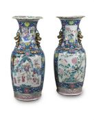 A large pair of Cantonese Famille Rose 'Daoist' vases