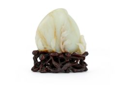 A Chinese russet white jade carving of 'Double Peaches'