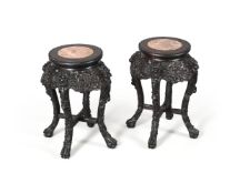 A pair of Chinese ebonised hardwood marble topped jardinière stands