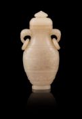 A small Chinese jade archaistic vase and cover