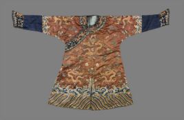 A Chinese chestnut-ground child's embroidered silk 'Nine Dragon Robe'