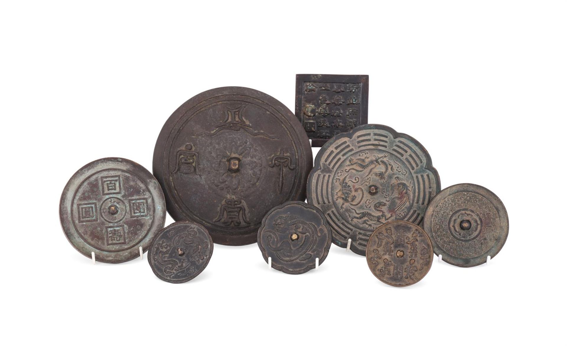 A group of eight assorted Chinese bronze mirrors