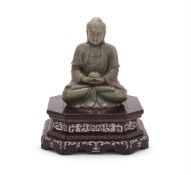 Y A pale celadon jade carving of a seated buddha