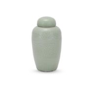 A Chinese celadon jar and cover