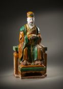 A large Sancai-glazed seated figure of a Daoist deity
