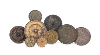 A group of nine assorted bronze mirrors