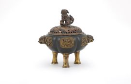 A parcel-gilt tripod 'Tonkin' censer and cover