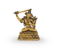 A Tibetan or Nepalese bronze figure of Manjusri