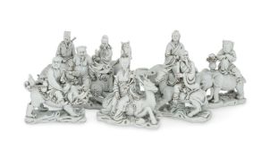 Eight Dehua style models of figures riding on various animals
