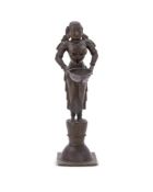 A bronze figure of Dipa Lakshmi