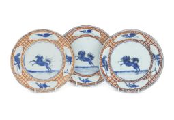 A set of three Chinese export 'Leaping Pekinese' plates