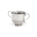 A WILLIAM III SILVER TWIN HANDLED PORRINGER