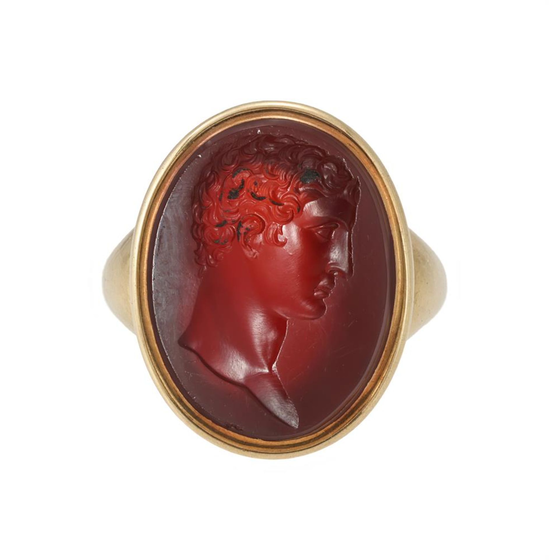 A CORNELIAN INTAGLIO ENGRAVED RING