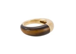 CARTIER, A POLISHED TIGERS EYE DRESS RING