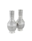 A PAIR OF EGYPTIAN SILVER COLOURED VASES