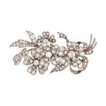 A MID 20TH CENTURY DIAMOND FLORAL SPRAY BROOCH