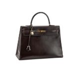 HERMÈS, KELLY, A BROWN BOX CALF LEATHER HANDBAG, CIRCA 1970