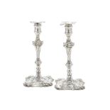 A PAIR OF GEORGE III CAST SILVER CANDLESTICKS