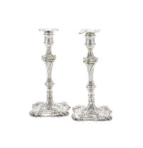 A PAIR OF GEORGE III CAST SILVER CANDLESTICKS