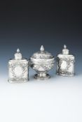 A CASED PAIR OF GEORGE II SILVER TEA CADDIES AND A SUGAR BOWL AND COVER