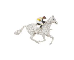 AN ENAMEL AND DIAMOND HORSE AND JOCKEY BROOCH